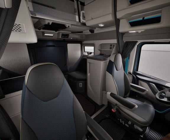 Volvo VNL cab featuring a versatile pulldown bunk and seating.