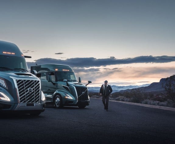 Volvo VNL trucks parked with driver highlighting MyTruck app