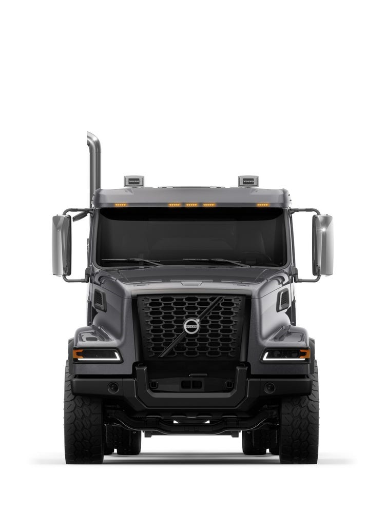 A Sable Metallic Volvo VHD semi truck seen head-on, showcasing its durable design, prominent bumper, and elevated cab.