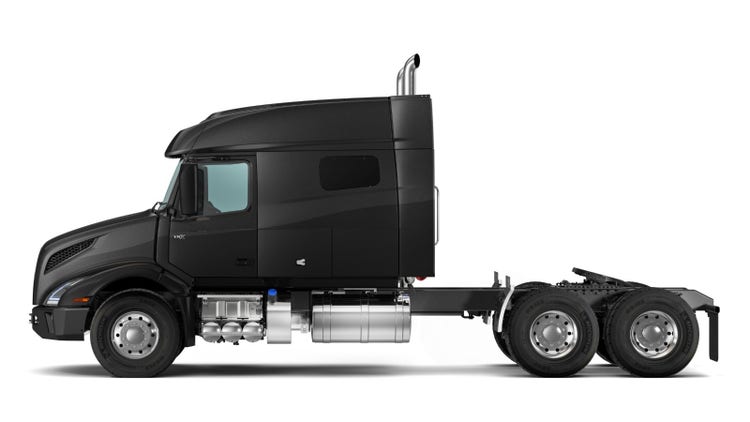 A black Volvo VNX semi truck cab seen in profile, with a spacious sleeper cabin, sturdy frame, and rugged wheels
