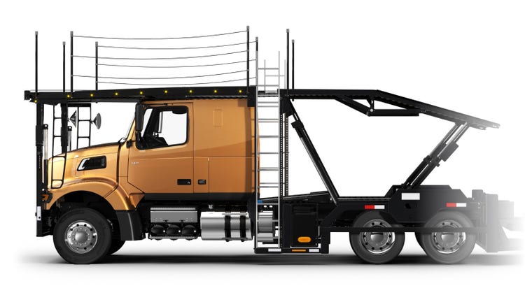Side view of a Premium School Bus Yellow Volvo VAH big truck designed for car hauling, featuring a low-profile cab, integrated ladder, and a multi-level car carrier structure.