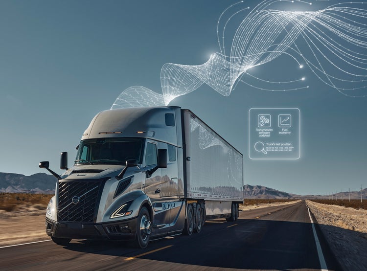 A Volvo big truck with digital graphics illustrating real-time diagnostics and connectivity features for 24/7 support
