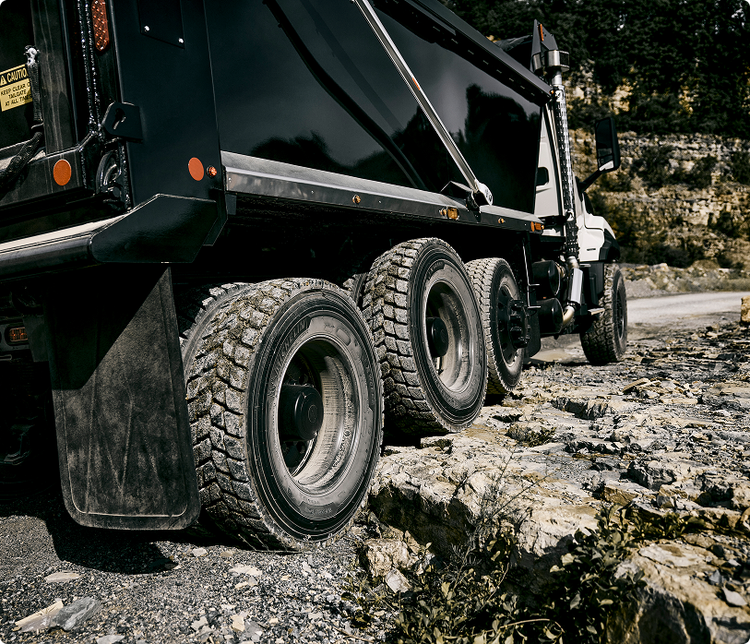 A close up look at the Volvo VNX wheels on the rocky roads that it is passing through.