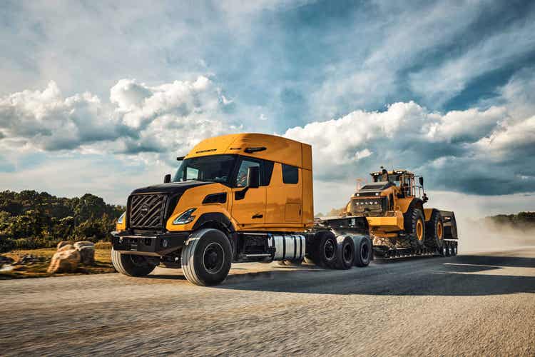 A yellow Heavy Haul truck on a dusty road.