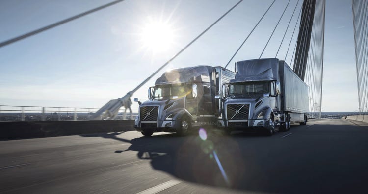A lineup of Volvo trucks showcasing different models.