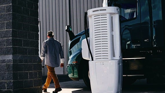 Volvo VNR at a charging station.
