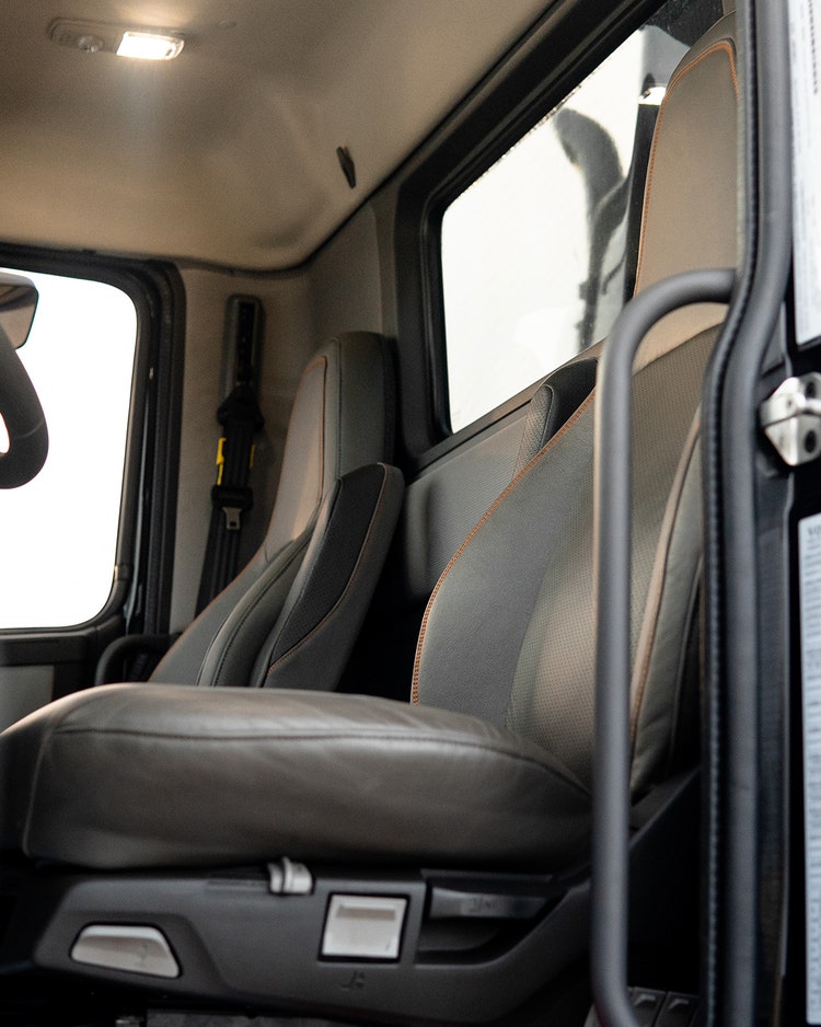 Interior view of the Volvo VHD truck, showcasing premium ergonomic seating designed for driver comfort and durability.
