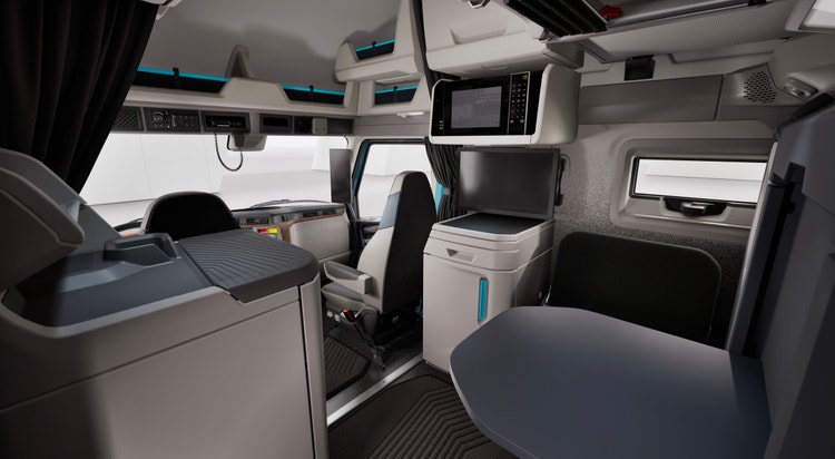 Spacious Volvo VNL sleeper cab with modern amenities, including a workstation, microwave, and ample storage for driver comfort.