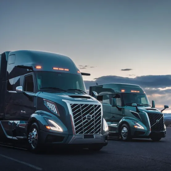White and orange semi truck representing Omega Cargo LLC professional fleet
