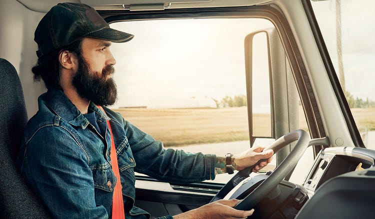 a Person is driving Volvo Truck