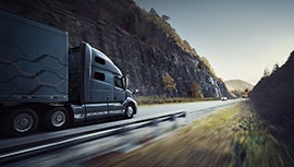 a truck driving along the road