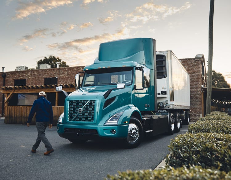 Side profile of a parked Volvo VNR Electric truck
