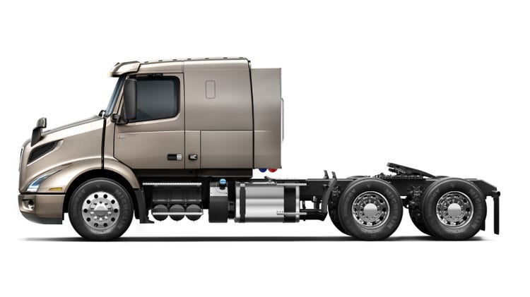 Side profile view of a Volvo VNR 400 truck.